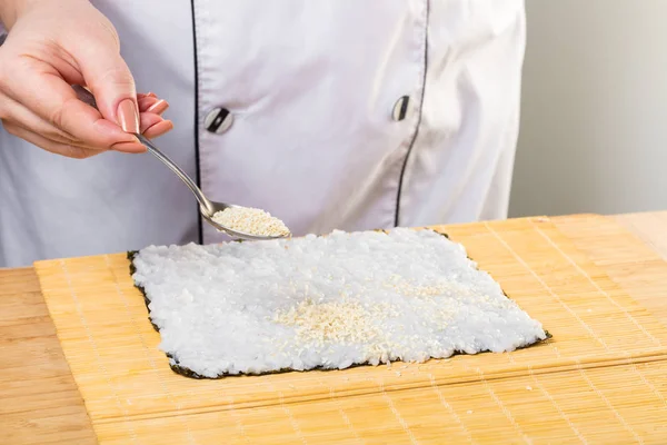Japanese chef. Chef prepares rolls, hands closeup