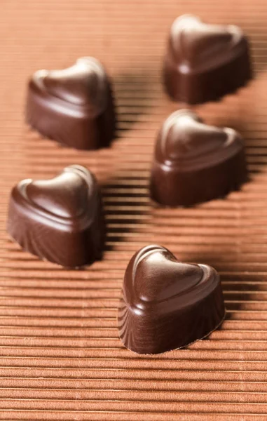Chocolate Candies Shape Heart Brown Background — Stock Photo, Image