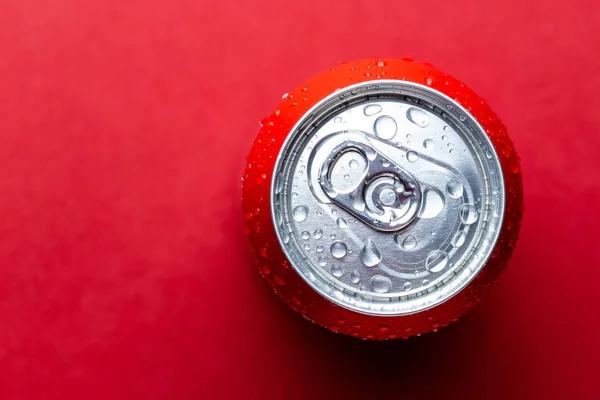 red Aluminum can over red background.