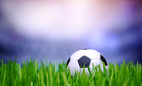 Soccer ball in stadium field — Stock Photo, Image