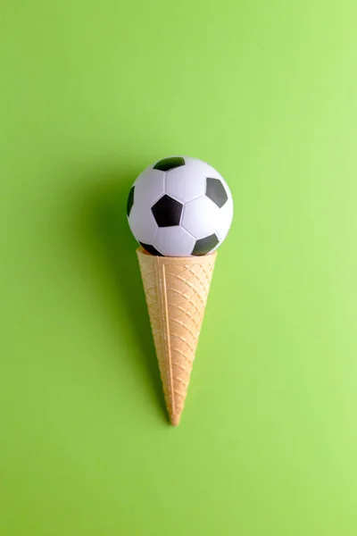 Ice cream cornet with soccer ball — Stock Photo, Image