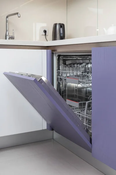 modern built-in open dishwasher. Selective focus