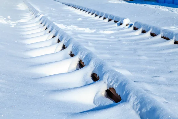 close-up shot of snow covered railway for background