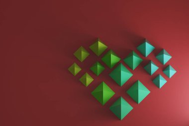 Yeşil 'den maviye doğru eğimli piramitlerin oluşturduğu kalbin üst görünümü, kırmızı zemin üzerinde, 3d biçimlendirme