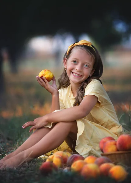 Cute Little Girl Eating Peach Garden — Stock Photo, Image