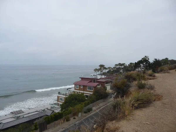 scenic view of cottages on sea shore