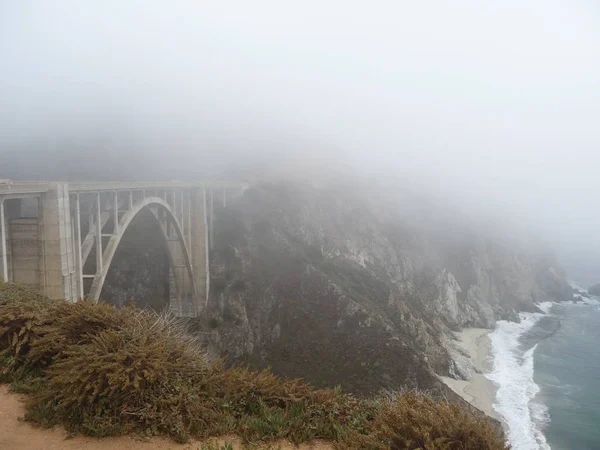 Scenic View Bridge Rocks Sea Covered Mist — Stock Photo, Image