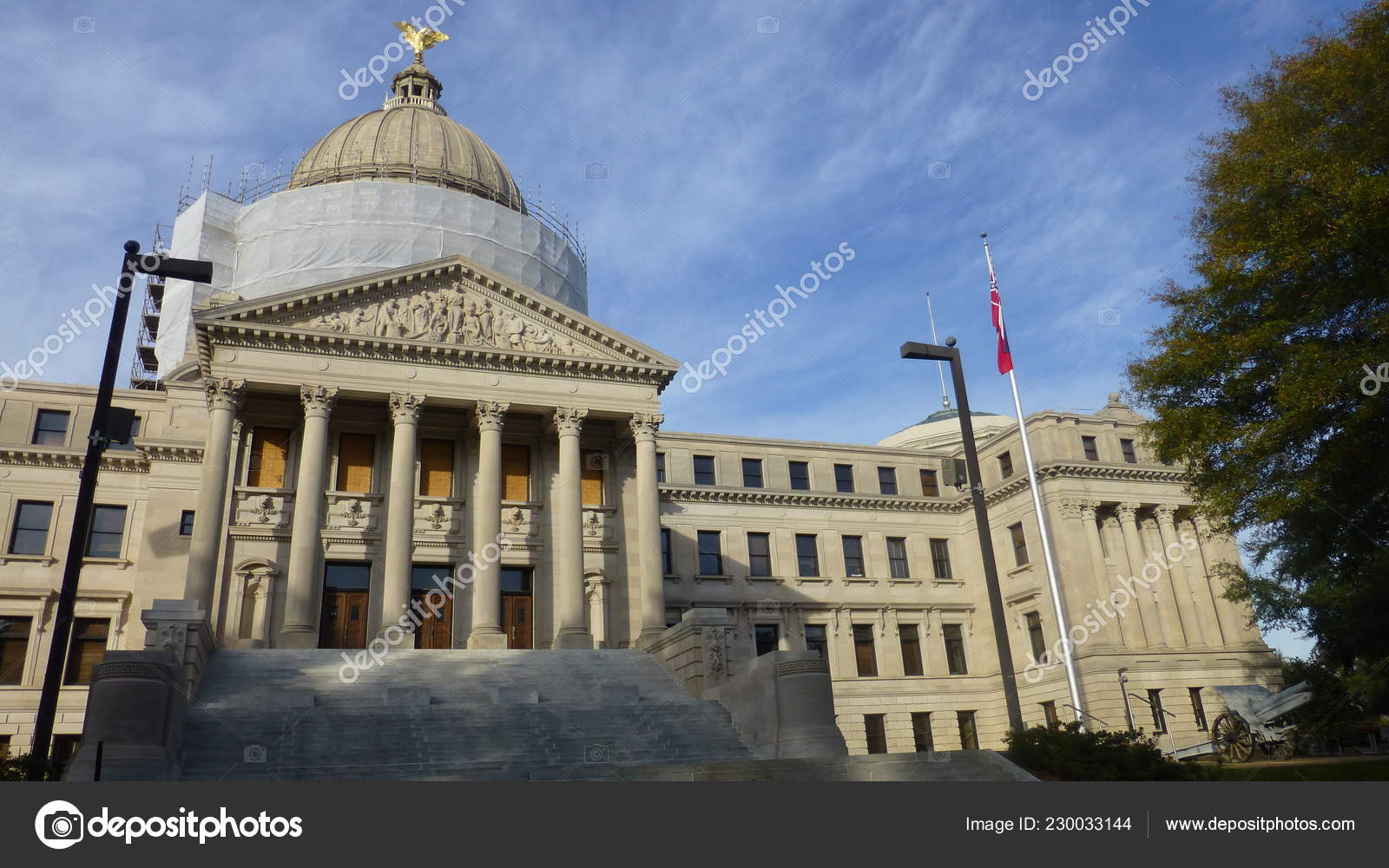 State Capitol Building Usa Flag Jackson Mississippi Stock Photo by