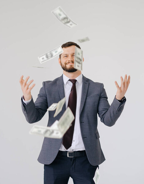 Businessman in suit portrait. Scattering money