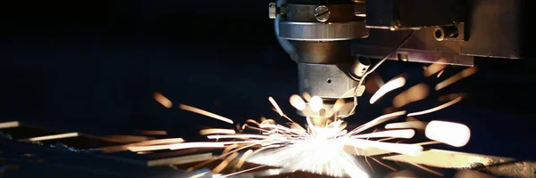 Sparks fly out machine head for metal processing — Stock Photo, Image