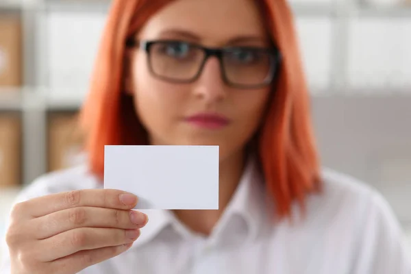 Female hand in suit give blank calling card