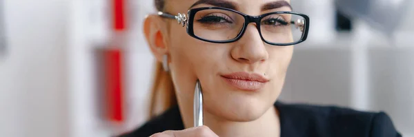 Pretty business woman in stylish glasses