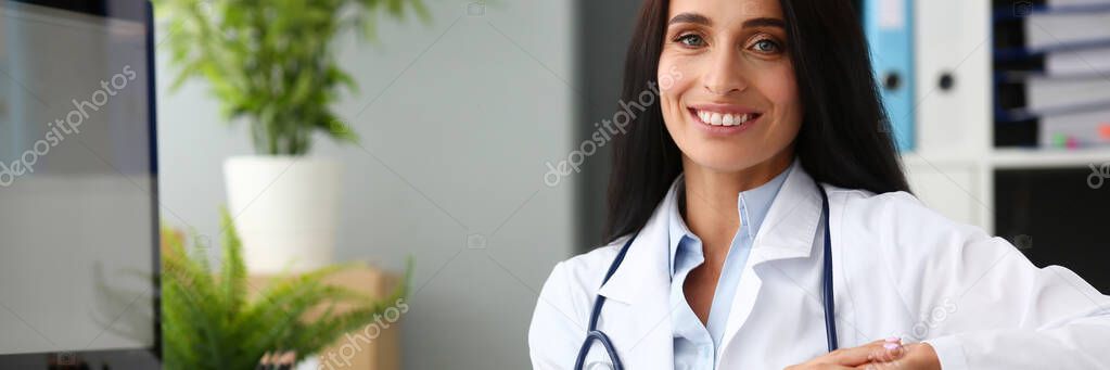 Indian female doctor portrait aganist hospital
