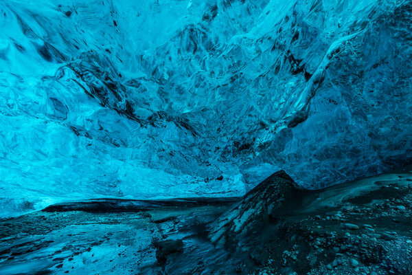 Ice Caves or Crystal Caves in Icelandic glaciers are a truly mesmerizing wonder of nature. The blue-glazed glacier blows away and creates amazing caves. Running water and black sand