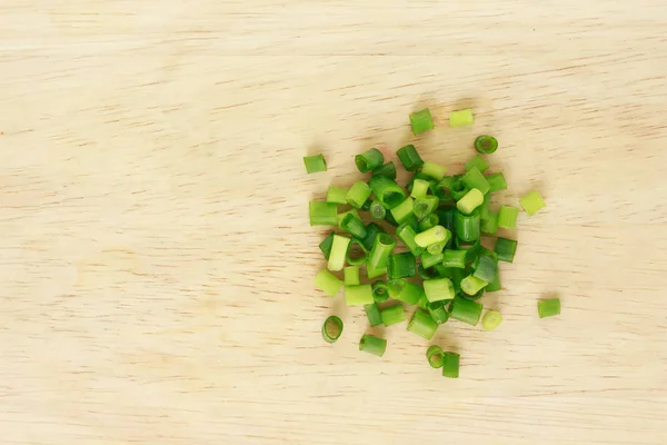 green onion cutted chives nature food on wood cutting board background