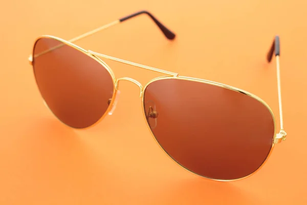Sonnenbrille Auf Orangenem Hintergrund — Stockfoto