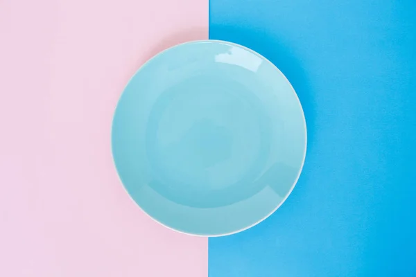 blue plate empty on pink rose quartz and serenity background