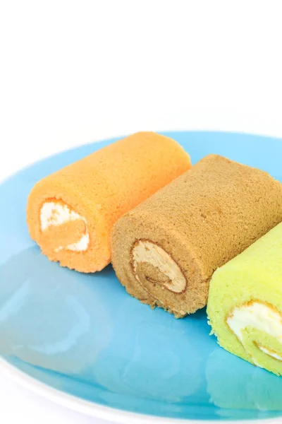 Rollo Pastel Naranja Chocolate Verde Sobre Azul Colocado Sobre Fondo — Foto de Stock