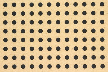 kahverengi kağıt doku arka plan üzerinde siyah nokta şekli.