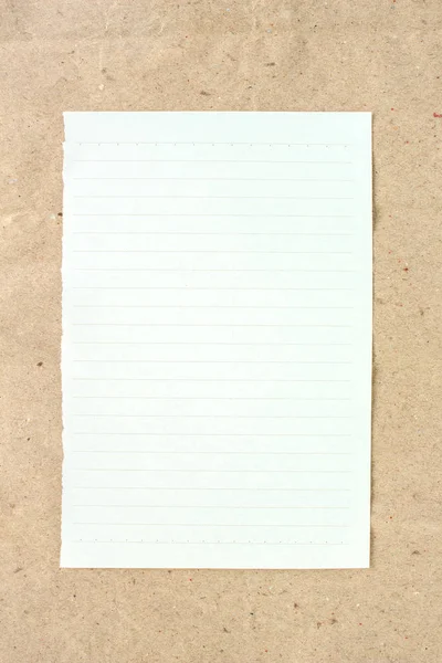 notebook on brown paper background.