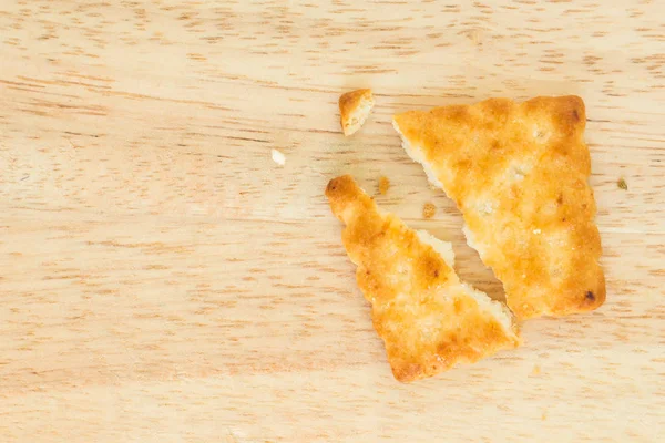 Crackers Broken Half Wooden Background — Stock Photo, Image