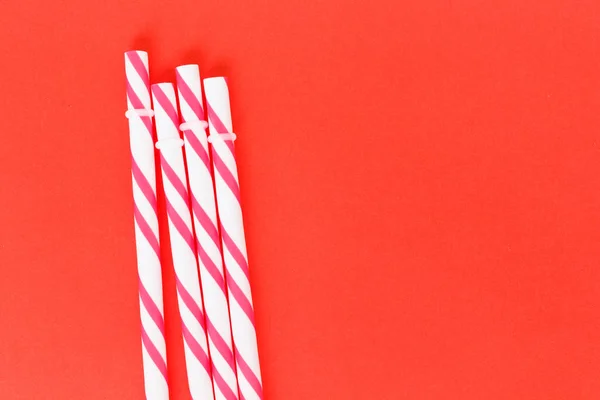 Red Striped Straws Pink Background — Stock Photo, Image