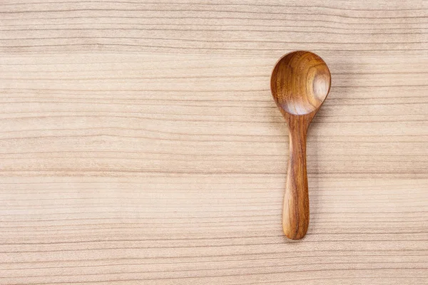 spoon wooden top view on wooden background.