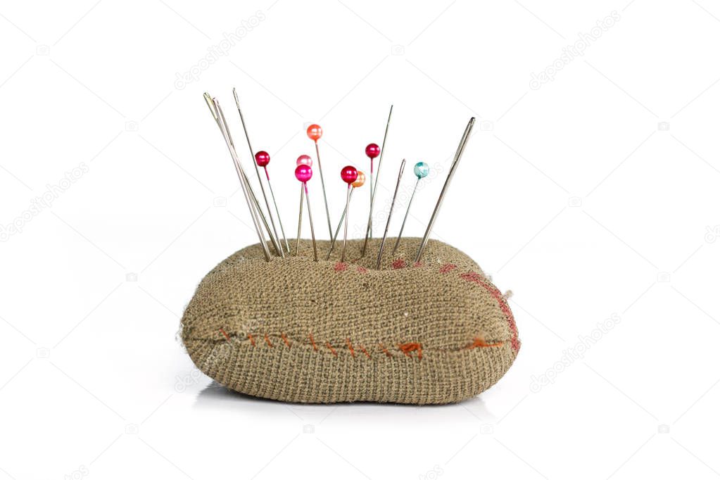 sewing pins on white background.