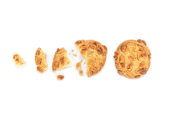 peanut cookie broken on white background.
