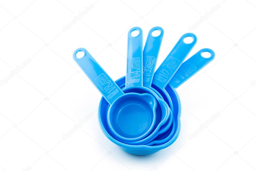 a set of measuring spoon of plastic on white background.