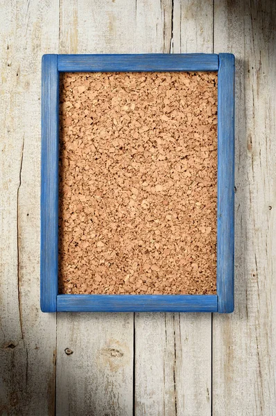 Corkboard Blue Frame Hanging Aged Wood Wall — Stock Photo, Image