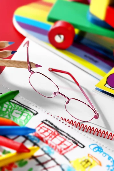 Glasses for childwith draws and toys — Stock Photo, Image