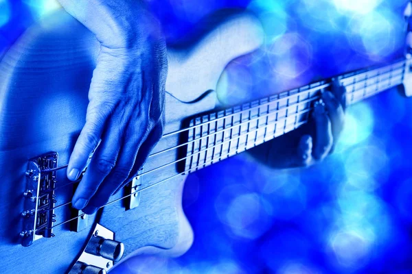 Rock bassist playing bass guitar — Stock Photo, Image
