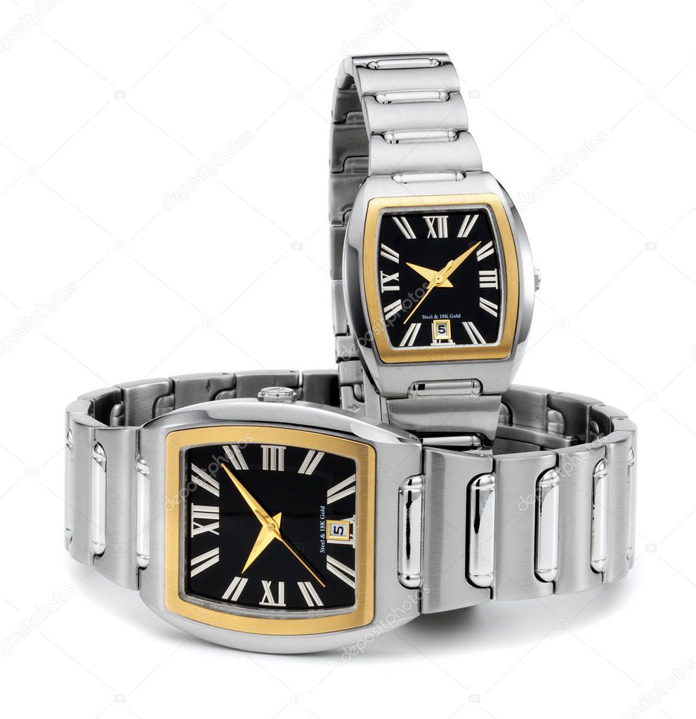 couple of stainless steel wristwatches