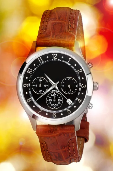 Wristwatch on color lights background — ストック写真