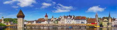 Panorama view of chapel bridge famous place on lake Luzern with blue sky and vintage building in Luzern, Switzerland, Europe. clipart