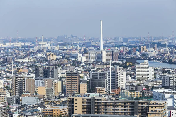 TOKYO ,JAPAN - OCTOBER 12: Tokyo city with Edogawa river and Biomass powerplant in sky view, OCT 12,2016, Tokyo, Japan. Tokyo city with Edogawa river and Biomass powerplant in sky view