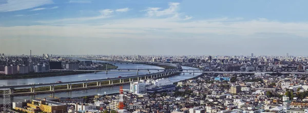 TOKYO ,JAPAN - OCTOBER 12: Tokyo city with  Arakawa river and highway roads in sky view, OCT 12,2016, Tokyo, Japan. Tokyo city with  Arakawa river and highway roads in sky view