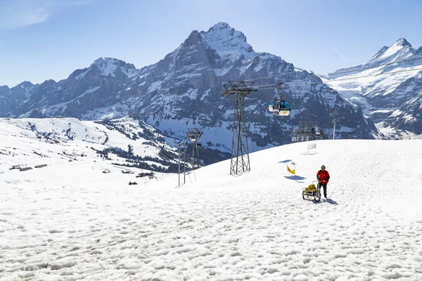 Gondola lift  with tower from Grindelwald to First peak cable ca