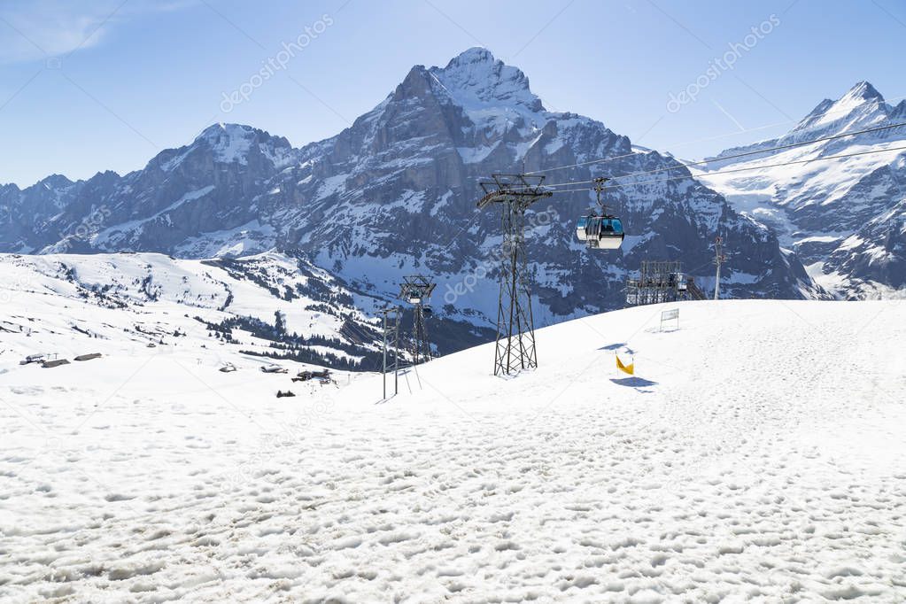 Gondola lift  with tower from Grindelwald to First peak cable ca