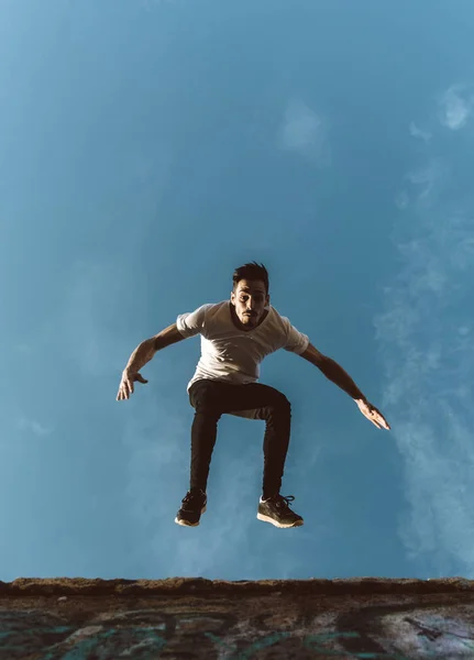 young sportsman practicing parkour.