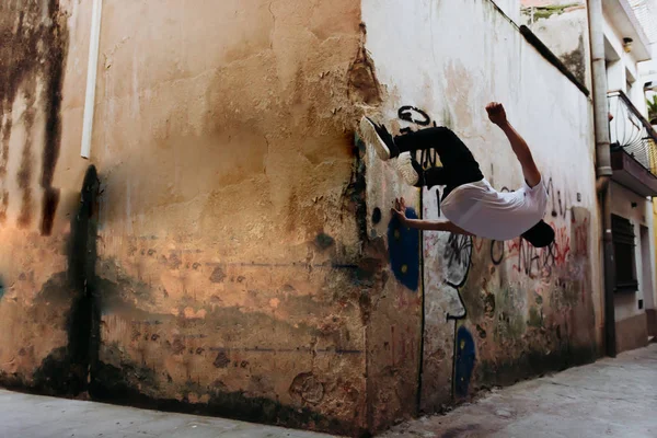 young sportsman practicing parkour.