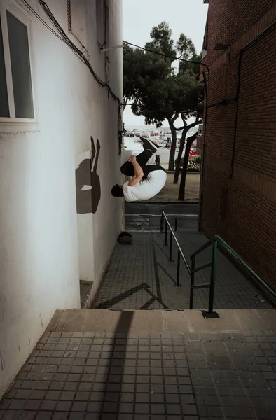 young sportsman practicing parkour.