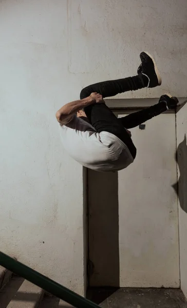 young sportsman practicing parkour.