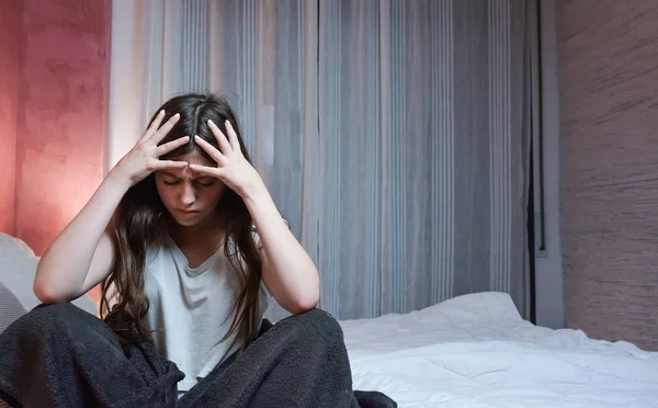 Teenage girl suffers from a severe headache — Stock Photo, Image