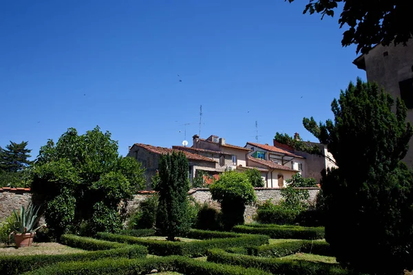 Old retro architecture with green trees