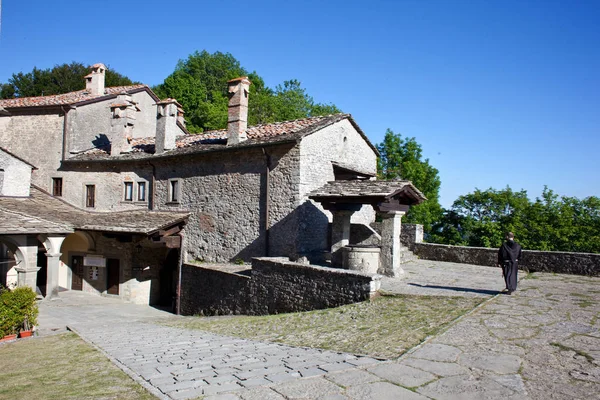 Old retro architecture with green trees