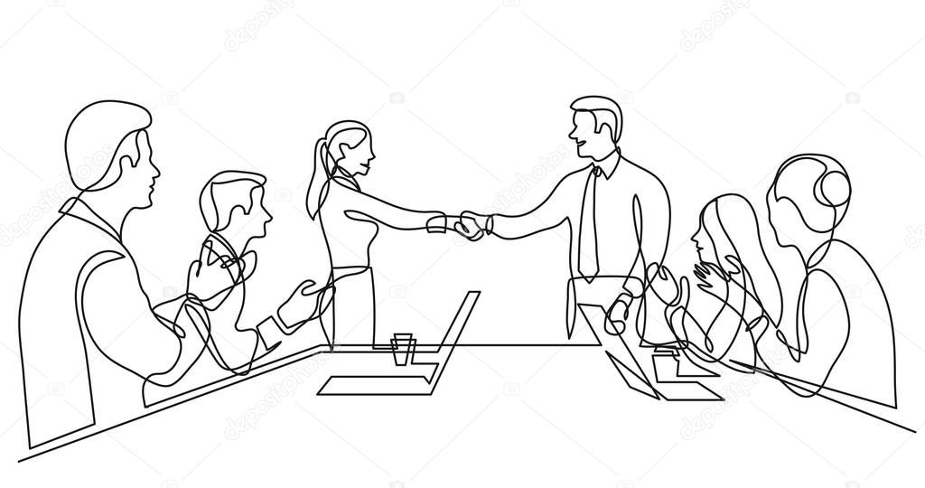 two team members shaking hands in front of work team