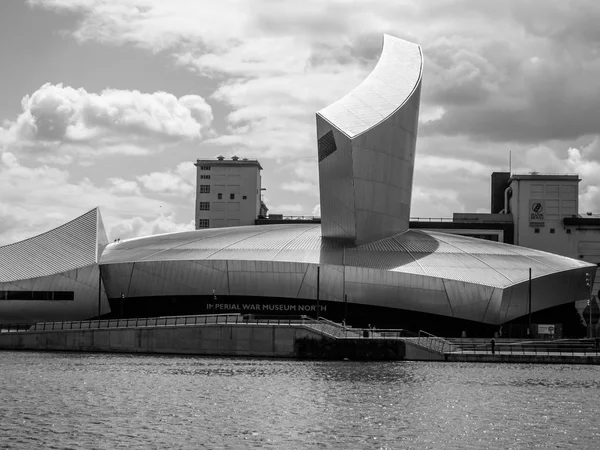 Imperial War Museum, Salford, Manchester, England. A black and white shot of the museum in Manchester showing the unusual architecture.