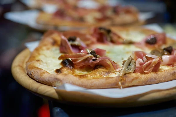 The concept of catering, in the kitchen ready pizza. pizzeria. Production and delivery of food. selective focus.